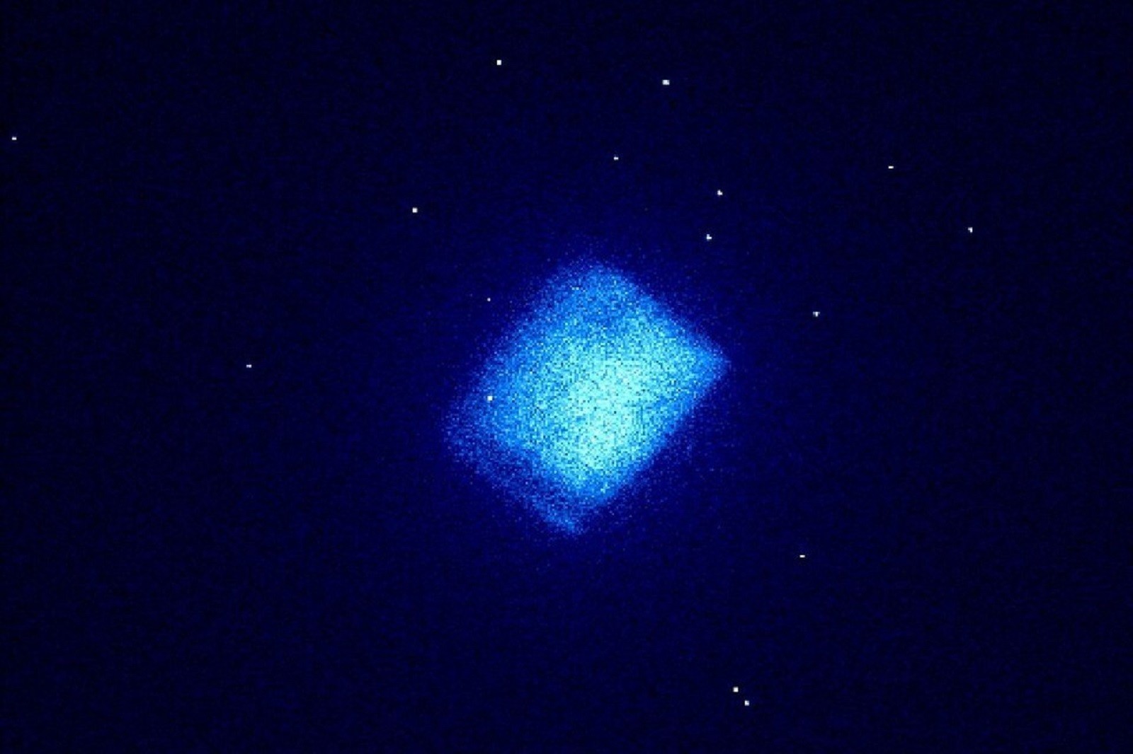 Weak radio luminescence, captured by a low light intensity camera, from a synthetic diamond carbon film made from beta-emitting carbon-14 atoms.
